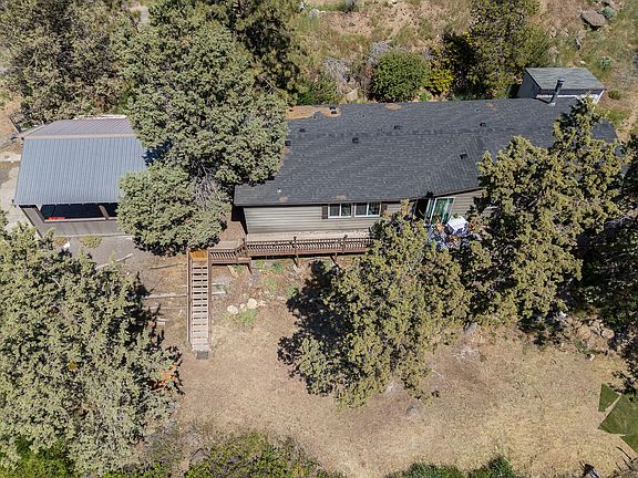 Manufactured home with large deck and with carport>