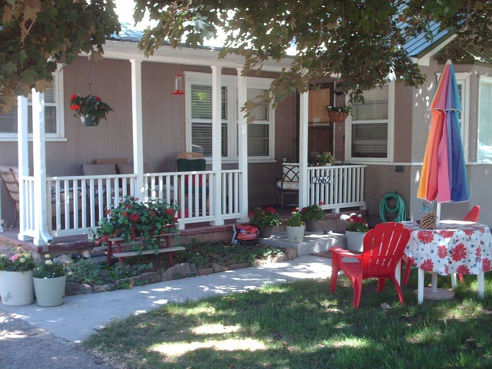Enjoy the front covered porch overlooking West 2nd Avenue