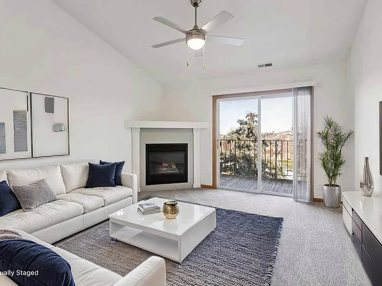 Bright, open living spaces make it easy to settle in for cozy evenings, casual gatherings, or quiet mornings by the fire.