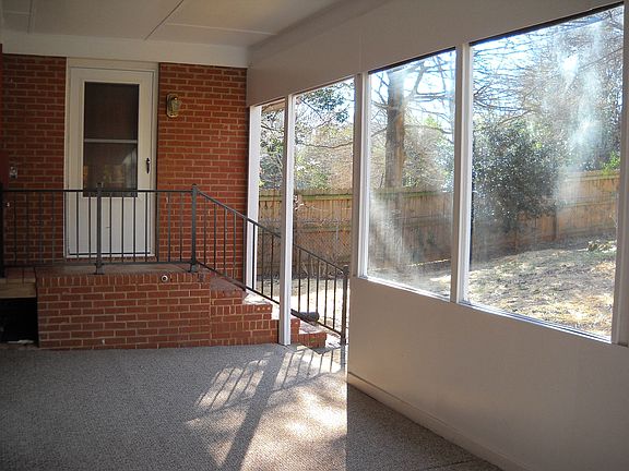 9x20 glass porch overlooking fenced back yard