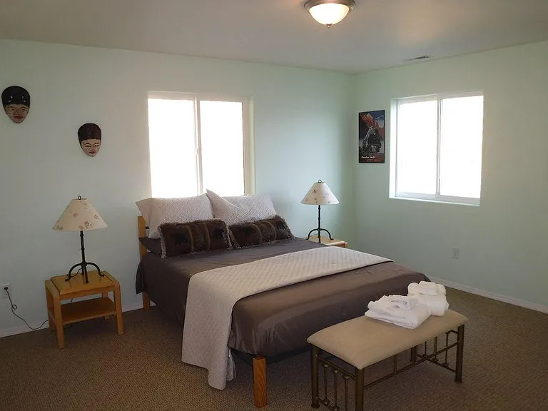 Bedroom three with a queen bed and lake views.