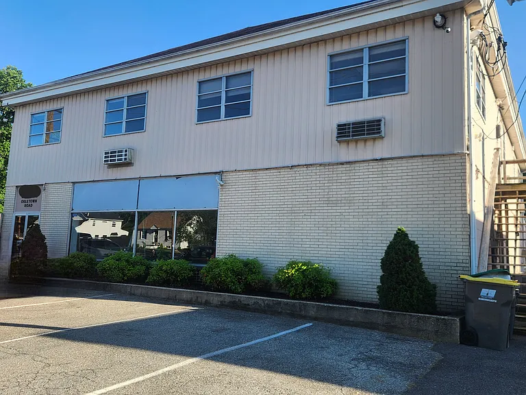 Front of building with parking and plenty of cameras for security