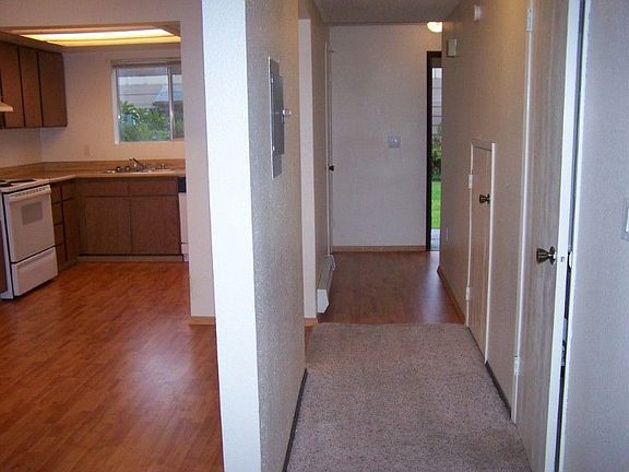 Hallway from front door with 1/2 bath on the right.