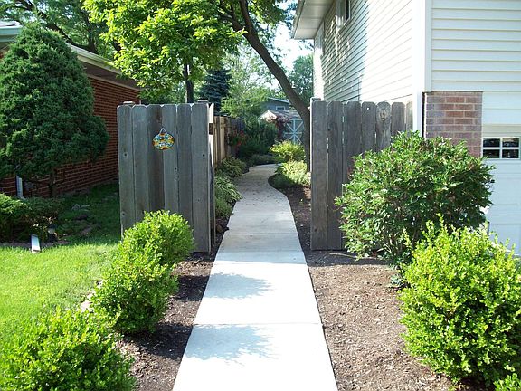 New concrete sidewalk to backyard