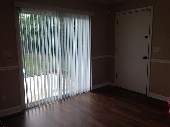 Back door leading out to large, fenced in back yard