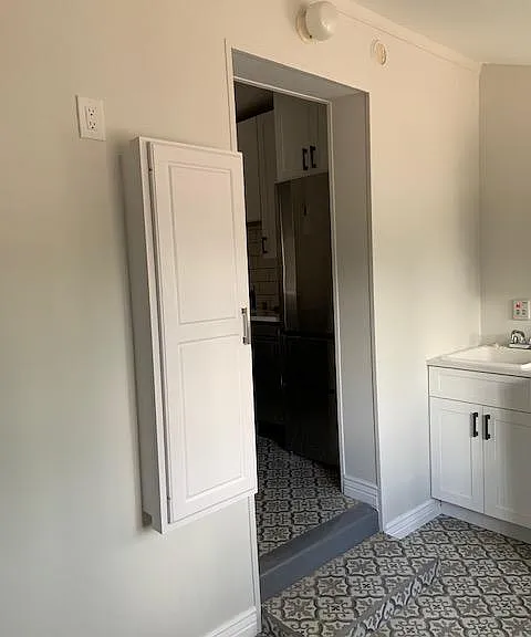 For those folks who still iron--an in the wall ironing board with storage for the iron and spray starch. You don't iron. No worry, use it to fold clothes or wrap gifts.
