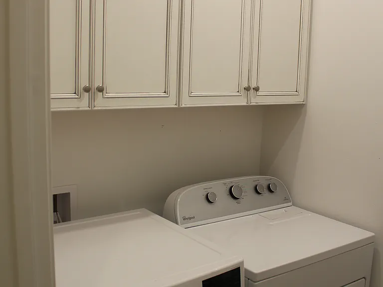 laundry room with washer and dryer included