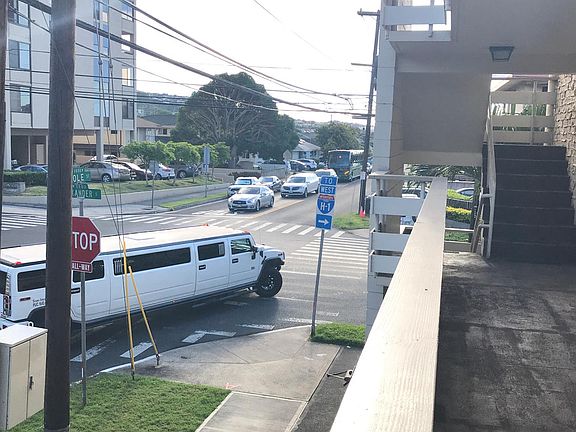 View to the right of walkway in front of door.