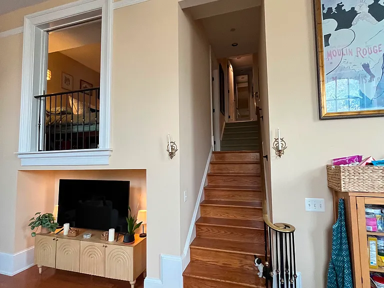 Stairs to second floor with loft bedroom and separate full bathroom.
