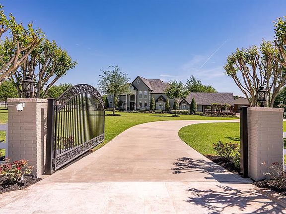 This property offers great curb appeal with its lush landscaping, mature trees and country style fencing! This home also boasts a camera system that is sure to give you piece of mind!