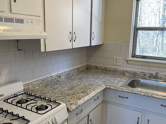 Recently renovated kitchen includes gas stove.