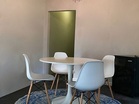 Dining room with beautiful chandelier from Spain, table, cha