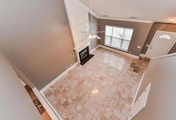 Gorgeous tile throughout Living Room with Fireplace and a Cathedral ceiling