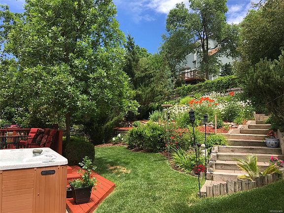 The living room is nice and light with all the windows and vaulted ceilings
