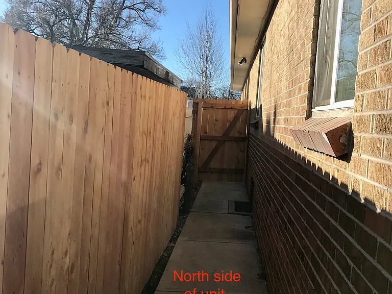 North side of unit. Ideal spot to store trash and recycling bins