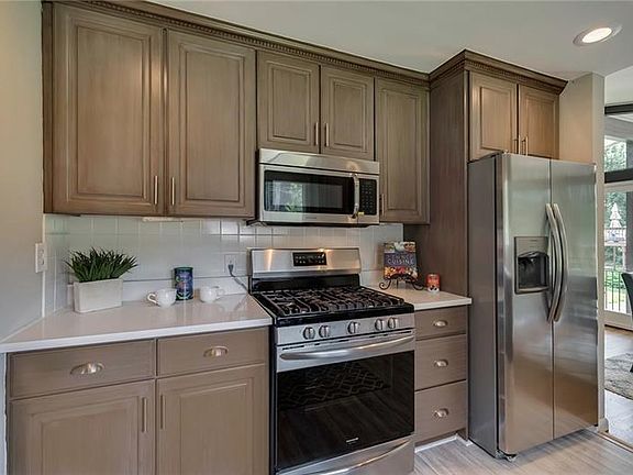Gas Stove and Built-In Microwave. Don't Miss the Recessed Lighting!