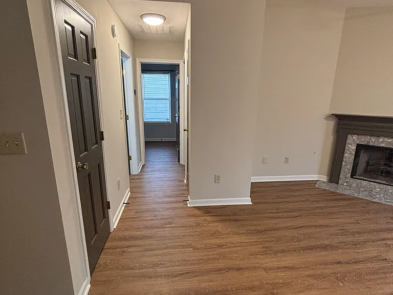 Hallway to guest bathroom and two bedrooms