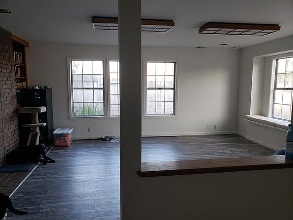 Entry way leading to living room. Tons of light.
