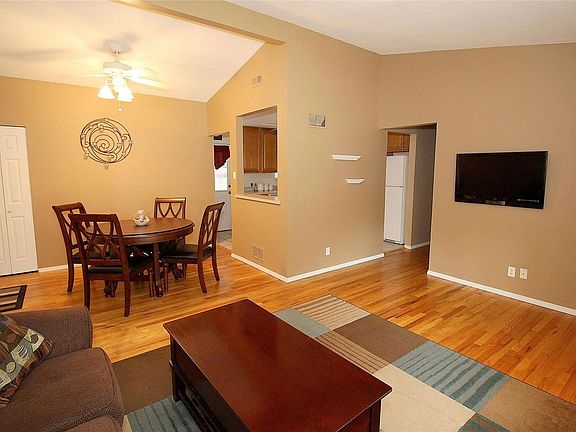 The vaulted ceiling extends to the Dining Room.