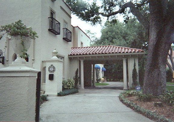 Half of wrap around driveway & car port