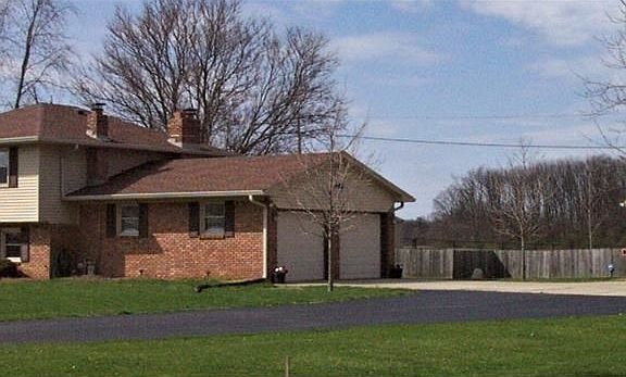 Side View of both Garages! With a huge Driveway for plenty of Parking!