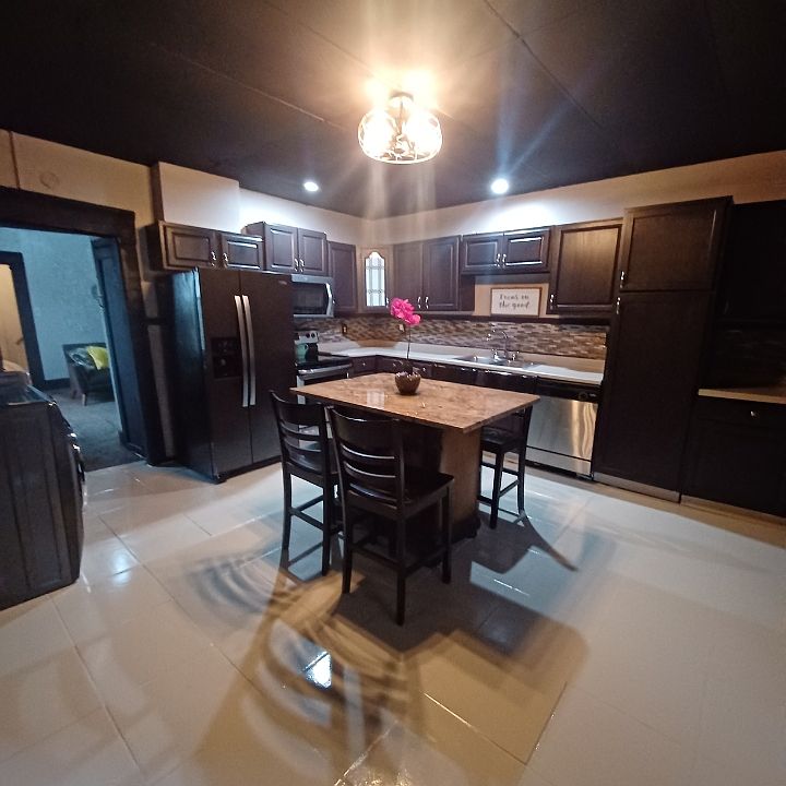 Kitchen with granite island, Stainless appliances, pantry, loads of cabinets.