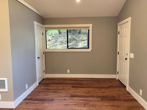 The cottage entry foyer, with coat closet is on the left, could be used as a second sleeping area or an office space.