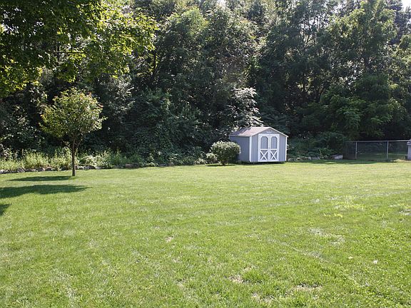 Large back yard with wooded no build zone