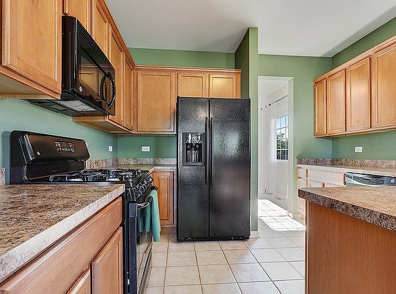 Lots of cabinet storage and counter space in this lovely kitchen.