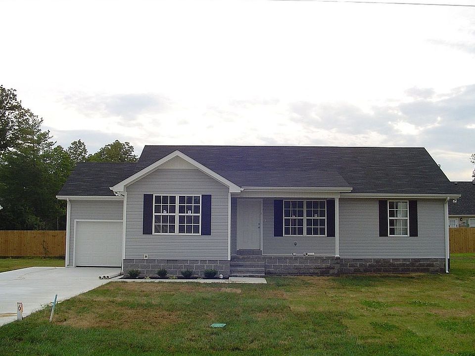 New home with concrete drive and landscaping