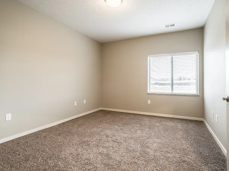 Our spacious bedrooms are filled with natural light.
