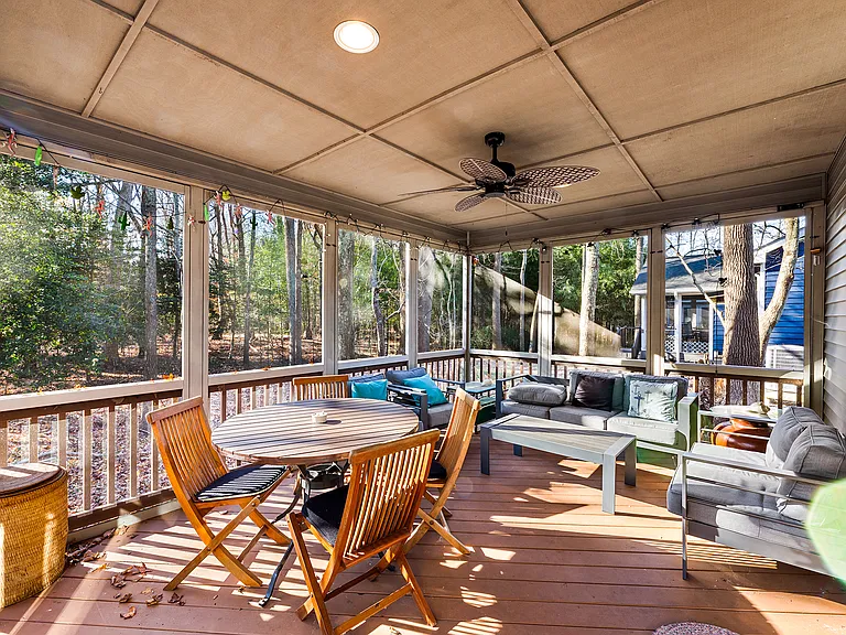 Relax on the screened porch with peaceful wooded views - perfect for morning coffee, reading, or unwinding at the end of the day