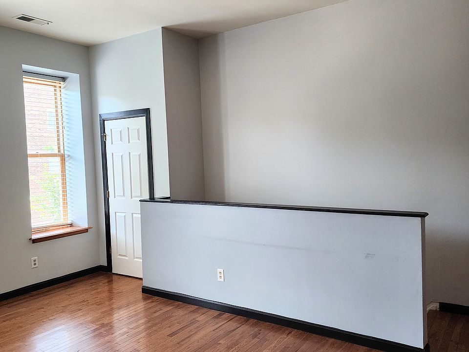 Living room opposite wall and staircase