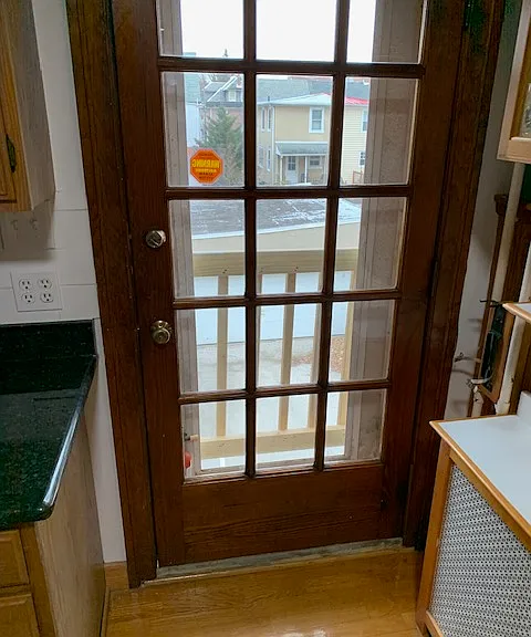 Door in kitchen that can be opened for fresh air.
