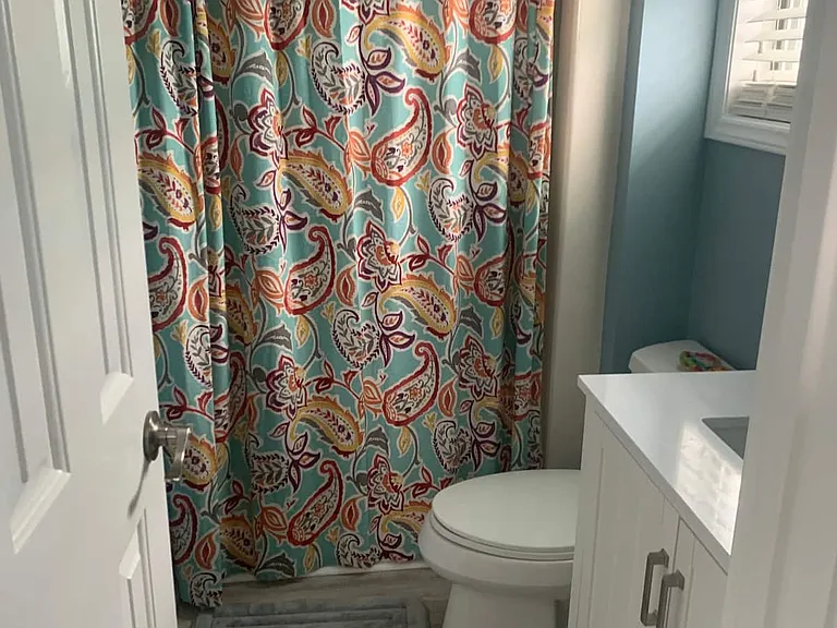 Master bath with stand up shower, toilet and sink