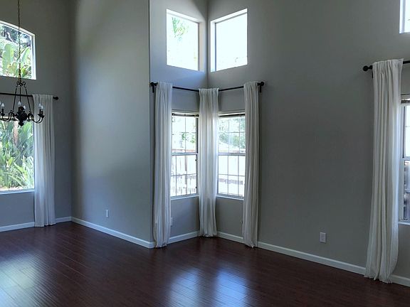 High ceiling living room with lots of light.