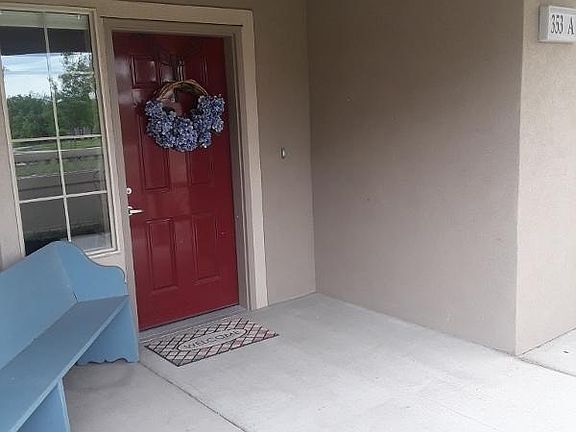 Covered patio and front entrance.