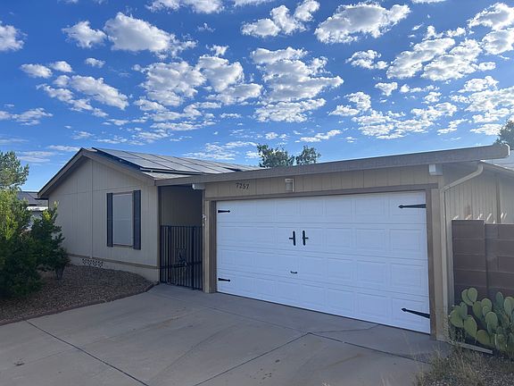2 car garage with 2 additional paved parking spots