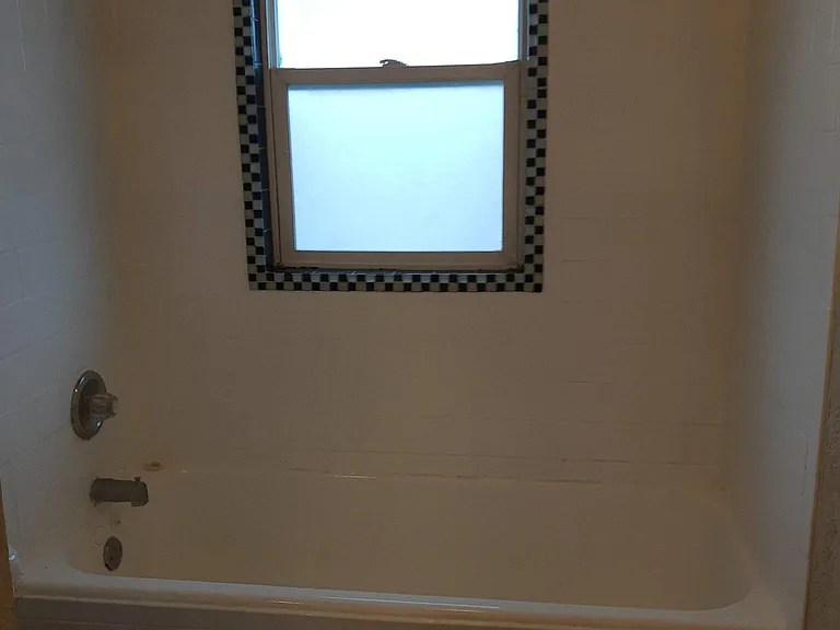 Original Retro Tilework adorn this Tub/Shower.