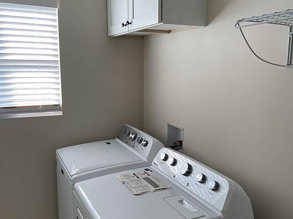 Washer & Dryer included right off the kitchen with large pantry and storage area.