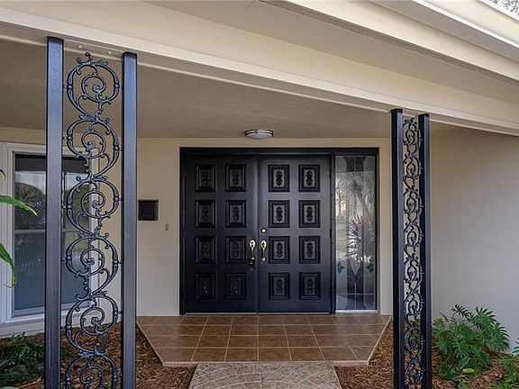 Covered Courtyard Double Door Front Entrance