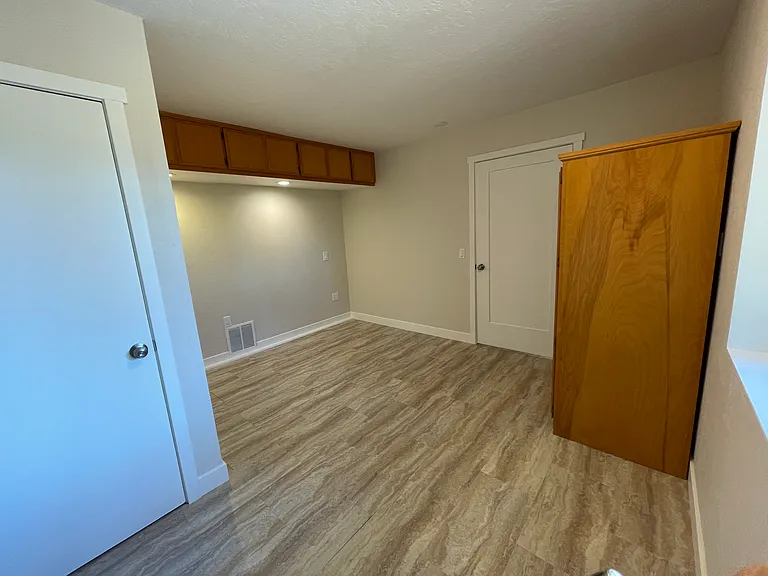 View where bed would be placed. White door is door to great room (kitchen & living).
