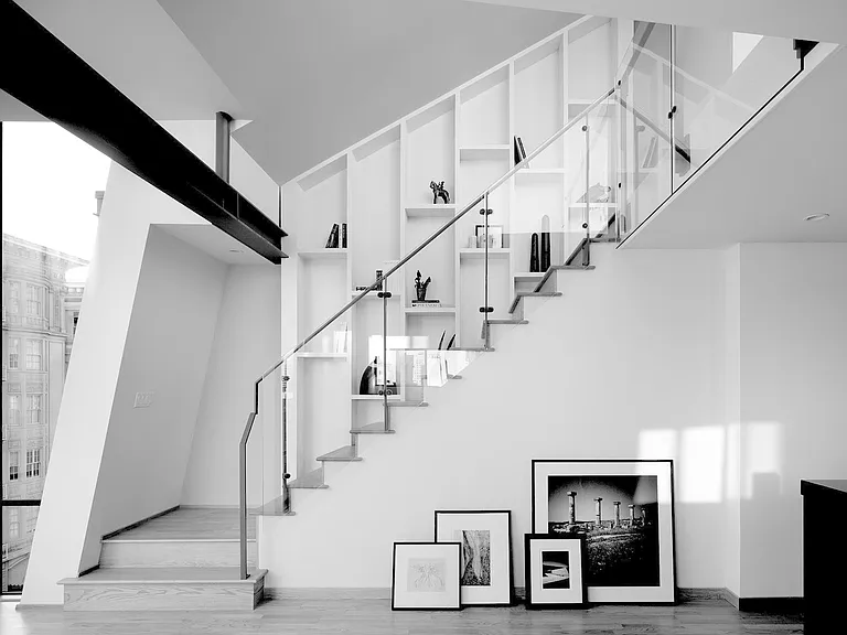 Living Room with Stairs to Deck with Display Shelving