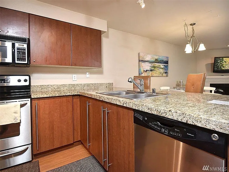 Open kitchen with stainless steel appliances
