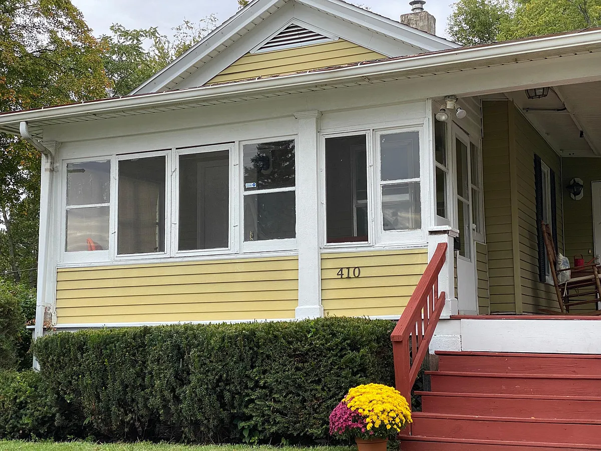 The front outside view of the sun porch - 410 E Mill St