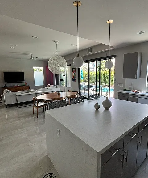 view from kitchen back towards the dining area and living room
