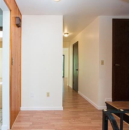 The hallway on the main level has a large coat closet and half bath.