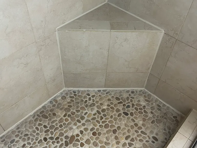Upgraded shower, tile and stone floor