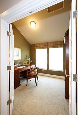 Den with french doors & vaulted ceilings