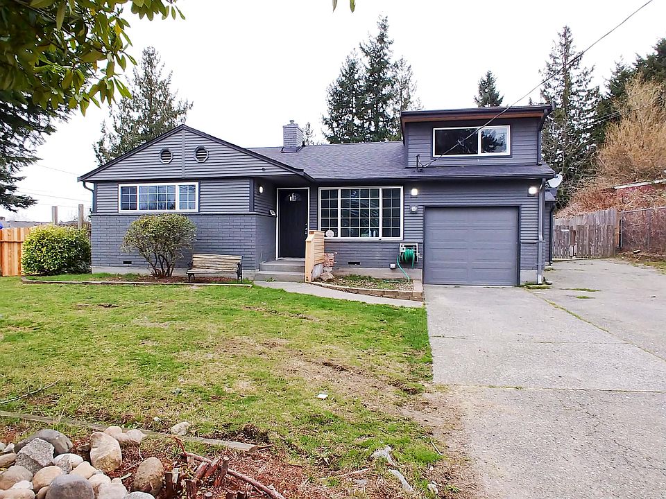 Exterior front. Look at that large driveway!